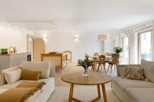 a living room with a couch and a table at Im Gräbele in Rosenfeld