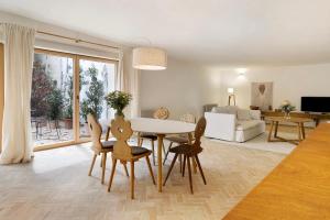 a living room with a table and chairs and a couch at Im Gräbele in Rosenfeld