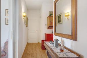a bathroom with a sink and a mirror at Casa Marta in Cavalese +30 photos