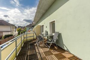 a balcony with a table and chairs on it at Fewo Schneider Bad Wildungen in Bad Wildungen