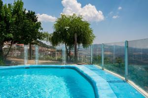 a swimming pool with a view of the mountains at El Rincón Del Duende in Pedro Bernardo