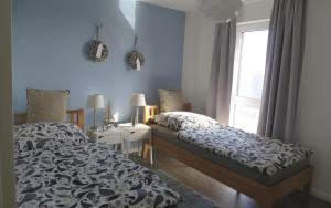 a bedroom with a bed and a window at Ferienhaus Olpenitz und Strand in Kappeln