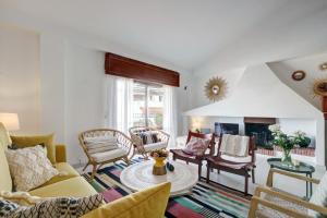 a living room with a couch and a table at La Casa de Manuel in Estepona