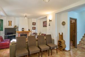a living room with a table and chairs at Casa Ginés in Iznájar