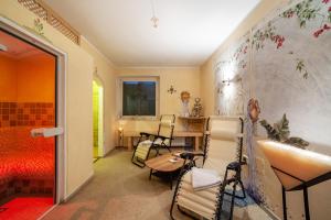 a room with chairs and a table in a room at Haus Hohenrain Ferienwohnung 3 in Schenna