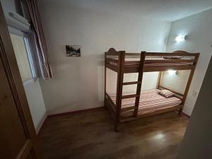 a room with two bunk beds in a room at L'Izard Piscine, Jacuzzi, Parking in Cauterets +20 photos