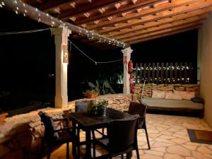 a table and chairs on a patio at night at Can Mussenya 2 in Illes Balears
