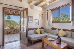 a living room with a couch and a table at Can Mussenya 2 in Illes Balears