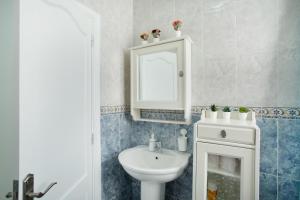 a bathroom with a sink and a mirror at El Rincón de Mónica in Agaete +44 photos