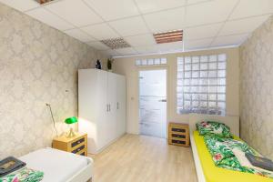 a small room with two beds and a window at Ferienwohnung bei Burg Eltz in Kaisersesch +18 photos