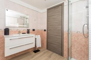 a bathroom with a sink and a shower at MSuite Etna Sicily in Macchia +21 photos