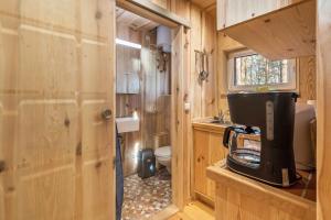 a small bathroom with a sink and a toilet at Bungalow 7 - Anglerinsel in Kollm +12 photos
