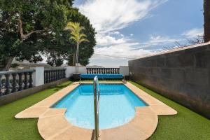 a swimming pool in the backyard of a house at Casa Llano del Rey in Arona