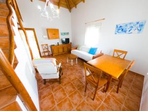 a living room with a table and a couch at Casas Pepe 5 Bungalow in Los Caños de Meca