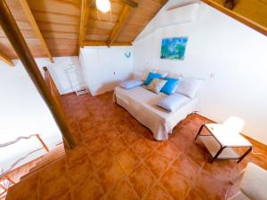 a large room with a bed and a table at Casas Pepe 5 Bungalow in Los Caños de Meca