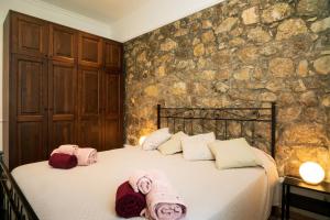 a bedroom with a bed with towels on it at Casa Carly Taormina in Taormina