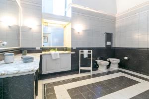 a large bathroom with two toilets and a sink at Villa Riggia - La Masseria in Nardò +36 photos