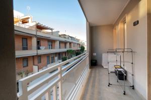 a balcony with a view of a building at Casadamare Salento in Brindisi