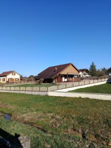 a fence in front of a house at Chalet Rivage Home in Pont-de-Poitte