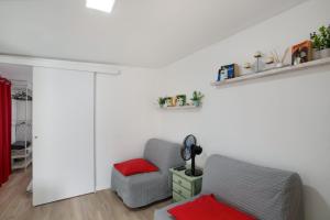 a living room with a couch and a chair at Villa Monica B in Agüimes