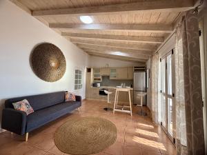 a living room with a couch and a kitchen at Villa Tequila in Adeje