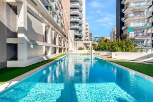 a swimming pool in the middle of a building at Calpe Beach in Calpe