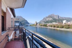 a balcony with a view of a river at La terrazza sull’Adda in Malgrate