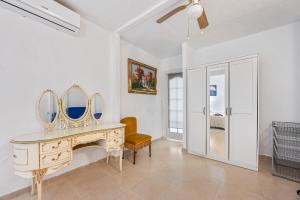a room with a dressing table with two mirrors at Villa Marbella -pool - Beach At 300 in Marbella