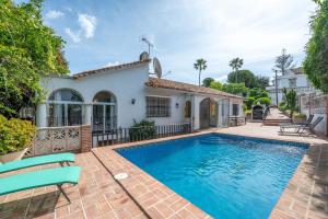 a villa with a swimming pool and a house at Villa Marbella -pool - Beach At 300 in Marbella