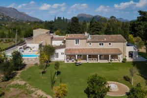 an aerial view of a house with a large yard at Can Mas Villa Antigua in Pollença
