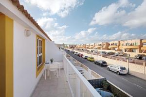a balcony with a view of a street at Casa sam in Caleta De Fuste