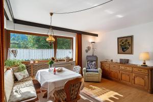 a living room with a table and a window at Haus Schindler in Ottenhöfen