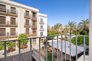 a view from a balcony of a building with palm trees at Casa Milano 1 in Jerez de la Frontera