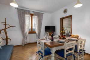 a dining room with a table and chairs at Podere Sasso 3 in San Gimignano