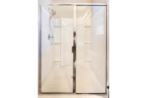 a shower stall with a glass door at Spacious Desert Suite Minutes to Phoenix Fun - Pet Friendly! in Avondale +22 photos