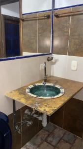 a bathroom with a sink with a faucet at Hotel Campestre Lucila in Estación El Salto +44 photos