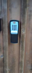 a remote control in a plastic box on a wall at Sonnenalm - Ferienwohnung in Reith