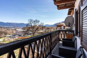 a balcony with a view of the mountains at Appartamento Cles in Cles
