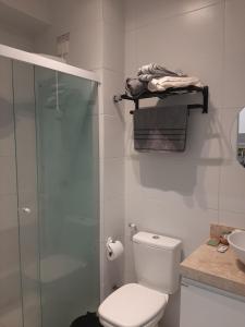 a bathroom with a shower and a toilet and a sink at Divina Hospedagem Compact Time in João Pessoa +24 photos