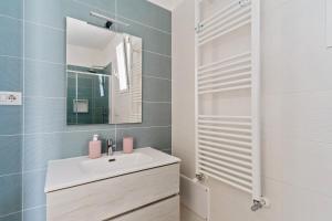 a bathroom with a sink and a mirror at Casa d'a mare in Torre San Giovanni Ugento +18 photos