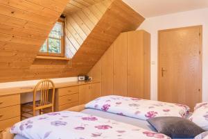 a attic room with a bed and a window at Oberwieserhof App 1 in San Lorenzo di Sebato +29 photos