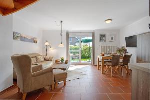 a living room with a couch and a table at Haus Schilfblick in Wieck