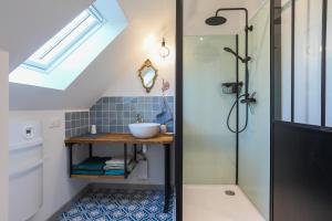a bathroom with a sink and a shower at Maison de vacances Kerkohann in Tressignaux +18 photos