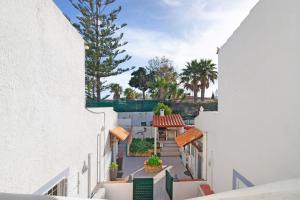 a view from the balcony of a building with a pool at Lemons Apartment in Carvoeiro