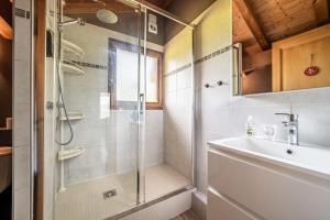 a bathroom with a shower and a sink at Chalet Marmottes in Morillon +37 photos