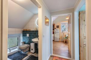 a bathroom with a sink and a toilet in a room at Ferienhof am See in Alt Zeschdorf +56 photos