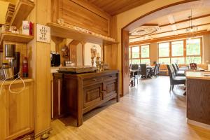 a kitchen and dining room with a table and chairs at Gästezimmer St Wendel in Prüm