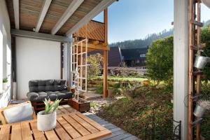 a screened in porch with a couch on a patio at Ruhige Schwarzwald Ferienwohnung in Buchenbach