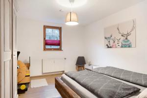 a bedroom with two beds in a room at Ruhige Schwarzwald Ferienwohnung in Buchenbach