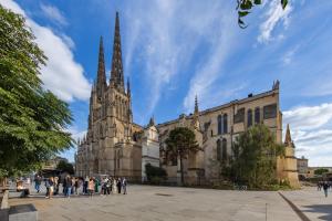 a cathedral with people walking in front of it at Chez Christian in Bordeaux